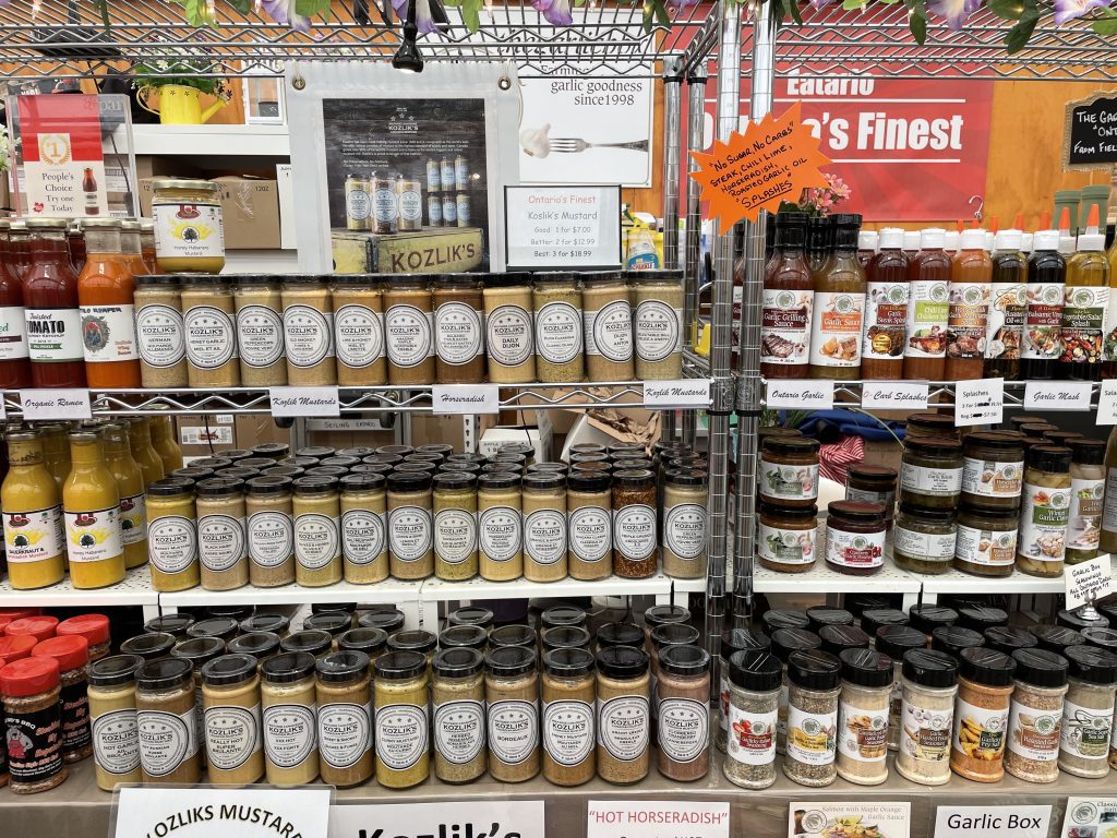 Shelves full of different mustards, spices and sauces at the St Jacobs Farmers Market