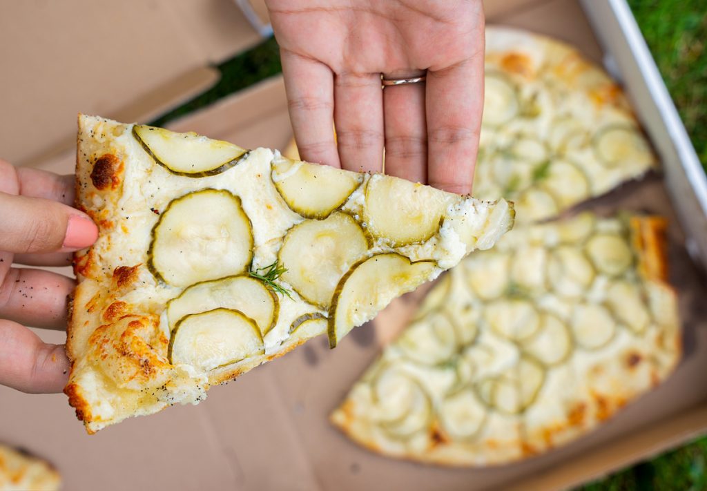 slice of dill pickle pizza from esca pizza
