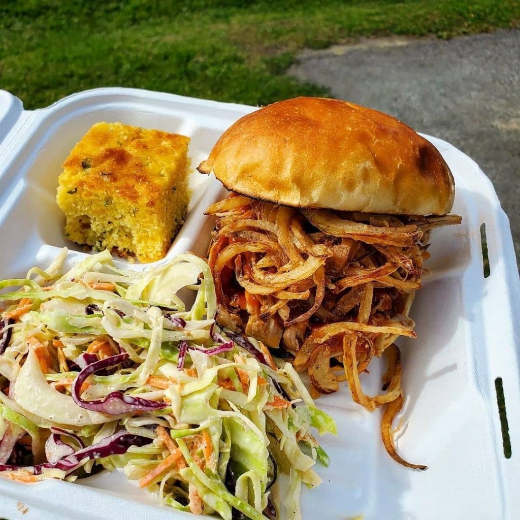 pulled pork sandwich with creamy cold slaw and freshly-baked corn bread