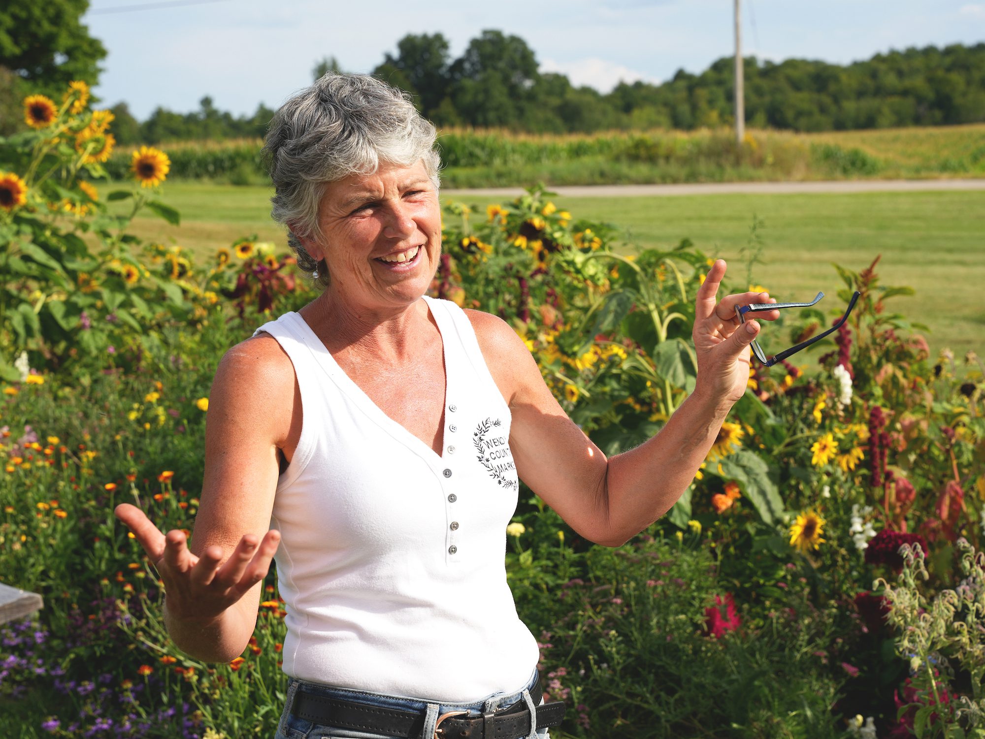 Wendy talking out in the garden at Furnace Falls Farm