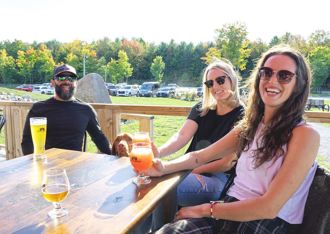 Group of friends grabbing a beer at Quayle's Brewery