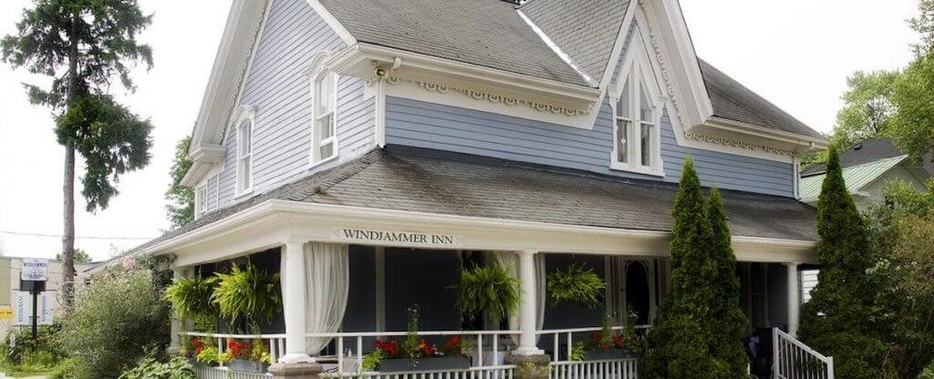 exterior of the windjammer inn, blue with big wrap around porch
