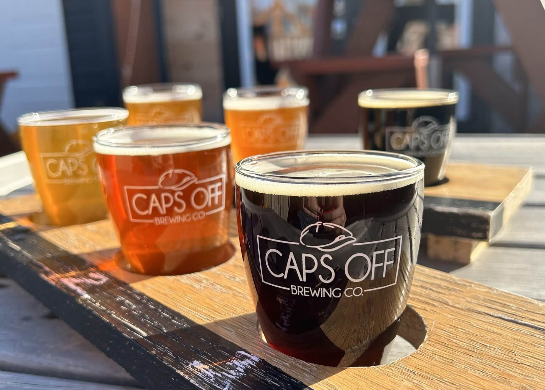 close up of flight outside on a sunny day at Caps Off Brewing Company