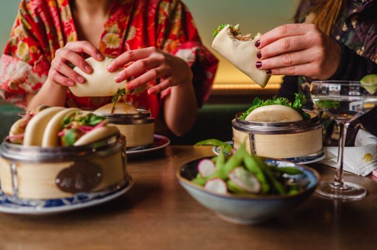 two people eating miss bao's