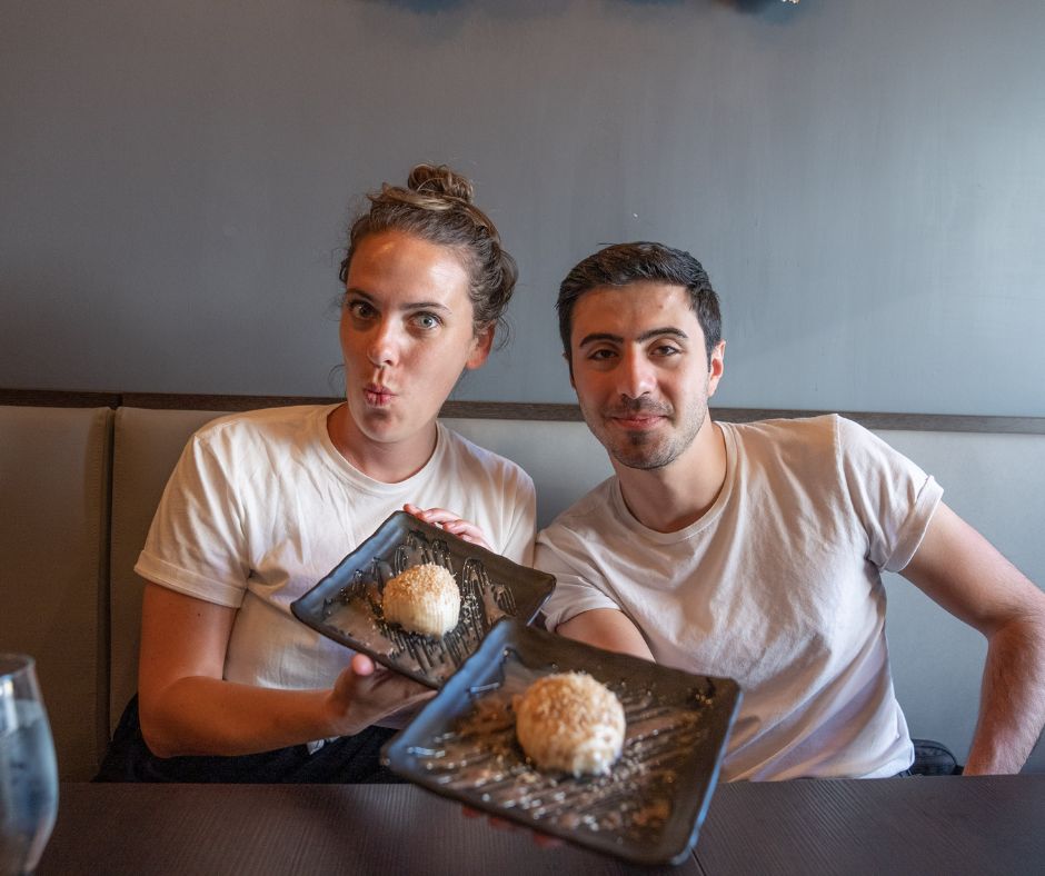 gabby and zain holding bao dessert