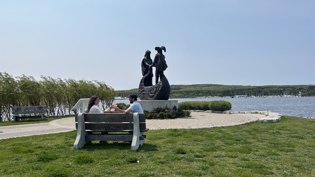 Abhigamya and staff fro Simcoe County enjoying a picnic in front of statue