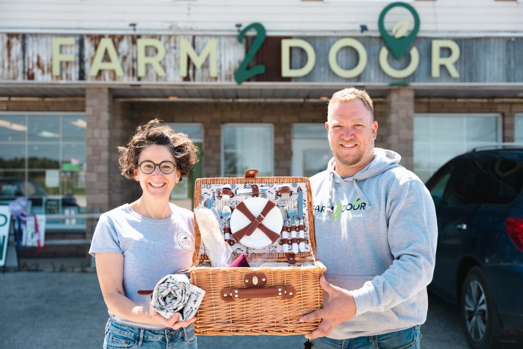 Kelly and Bart holding basket at Farm2Door