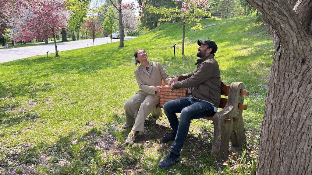 Cleo and Abhigamya enjoying a Farm 2 Door picnic under the cherry blossom tree at Little Lake Park. 