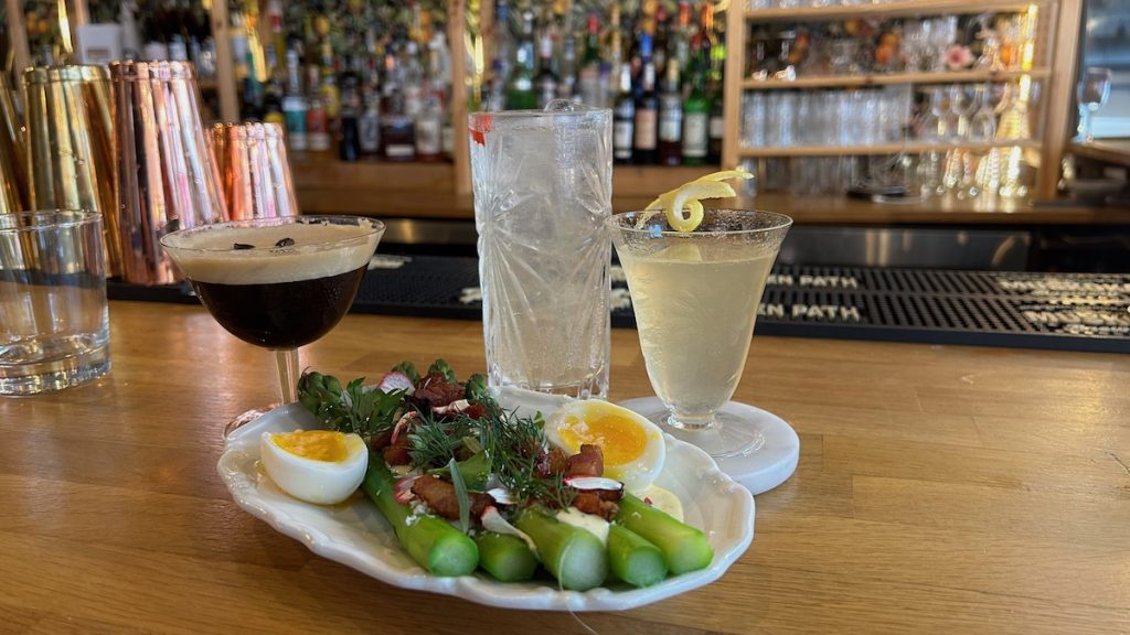 photo of asparagus and three cocktails at the lark