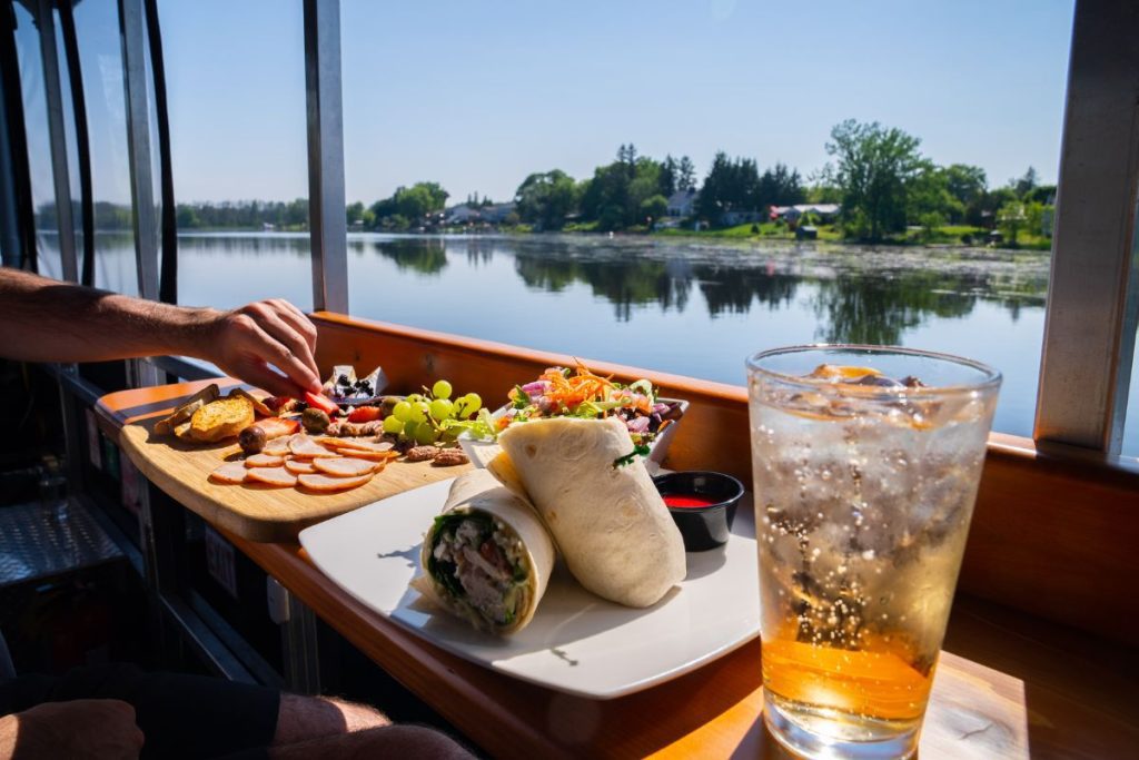 spread of food on the boat overlooking the Napanee River