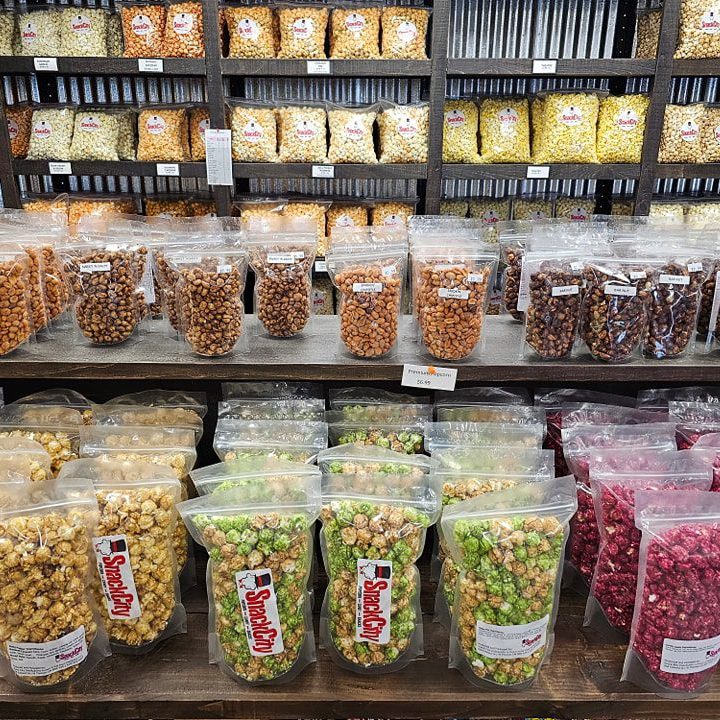 shelves of Snack City Popcorn in all different flavours