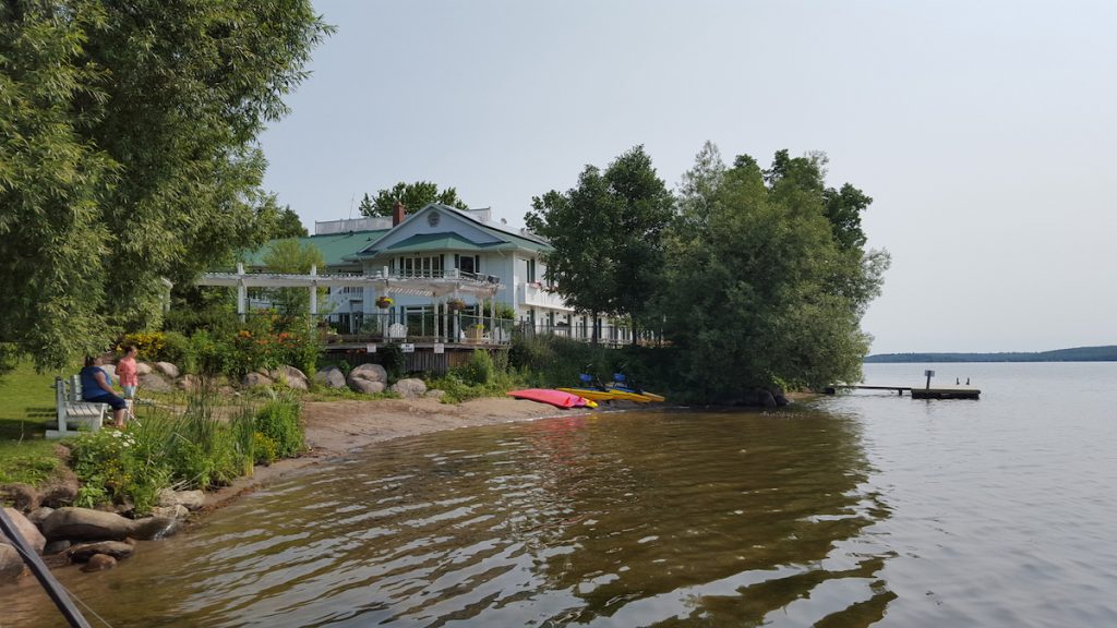 exterior photo of Elmhirst's Resort from the water