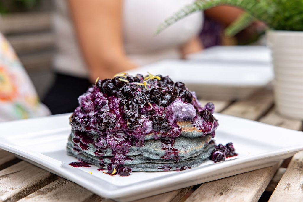 closeup of blueberry pancakes at brunch and co