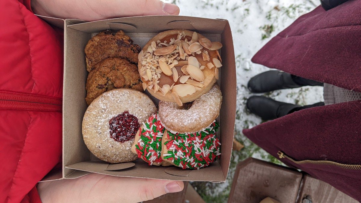 overhead shot holding a box of holiday baked goods from Anninas