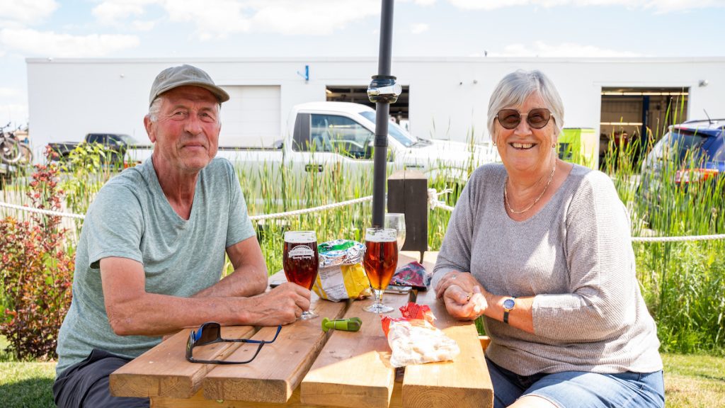 Couple enjoying a beer and snacks on the patio at Sleeping Giant Brewing Company