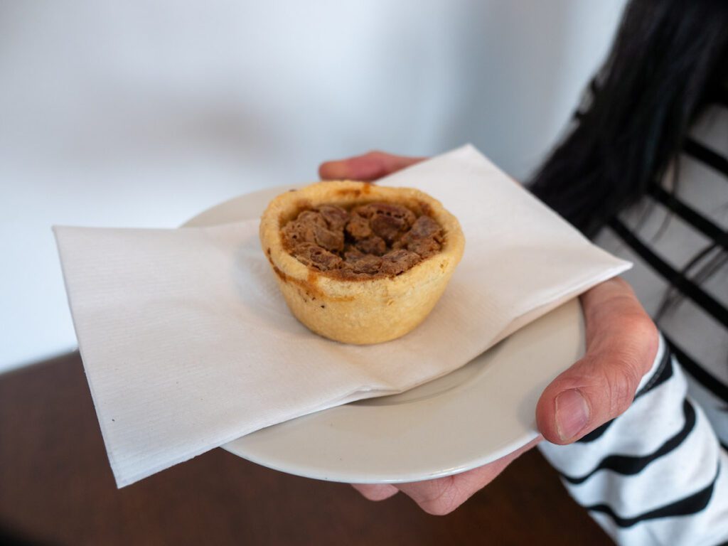 close up of stuffd bakery butter tart on a white plate