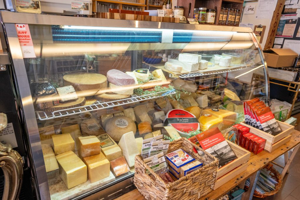 The cheese case at The Cheesy Fromage is full of goodies