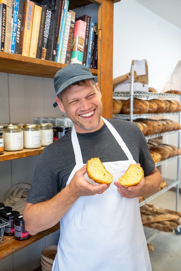 Baker Graham at Hard Winter Bakery shows off one of his all-butter croissants