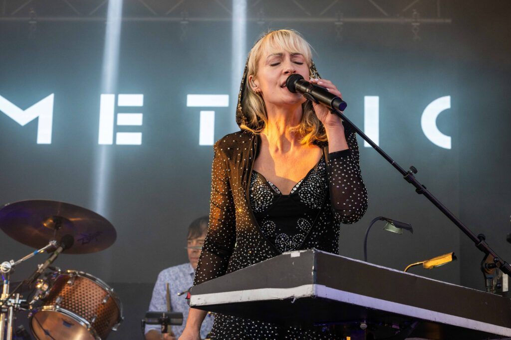 Metric performing at Peterborough MusicFest in July 2024