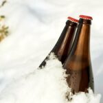 two bottles of beer in the snow