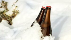 two bottles of beer in the snow