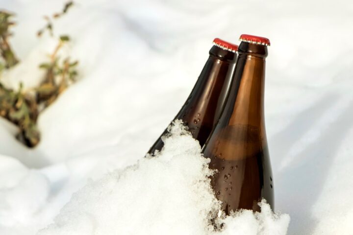 two bottles of beer in the snow