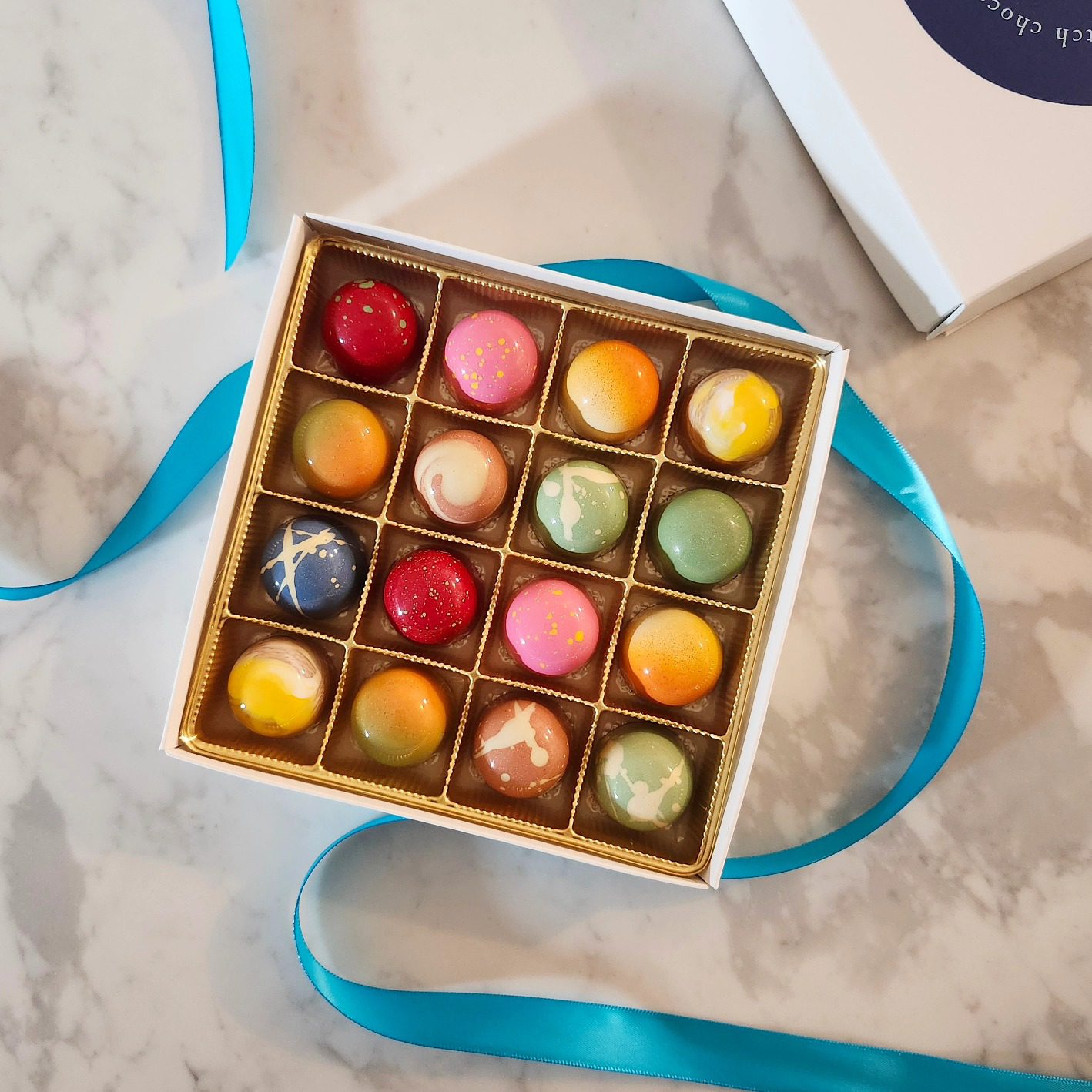 image of 16 chocolates in a box from Madam Bonbon.