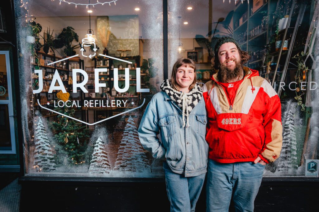 owners standing outside of Jarful Refillery on a winter day